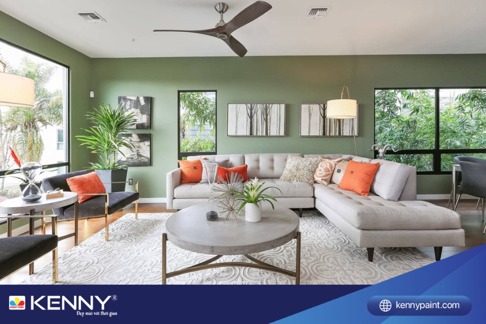 Phòng khách sơn màu xanh rêu toát lên vẻ hiện đại khi được kết hợp với các đồ nội thất 